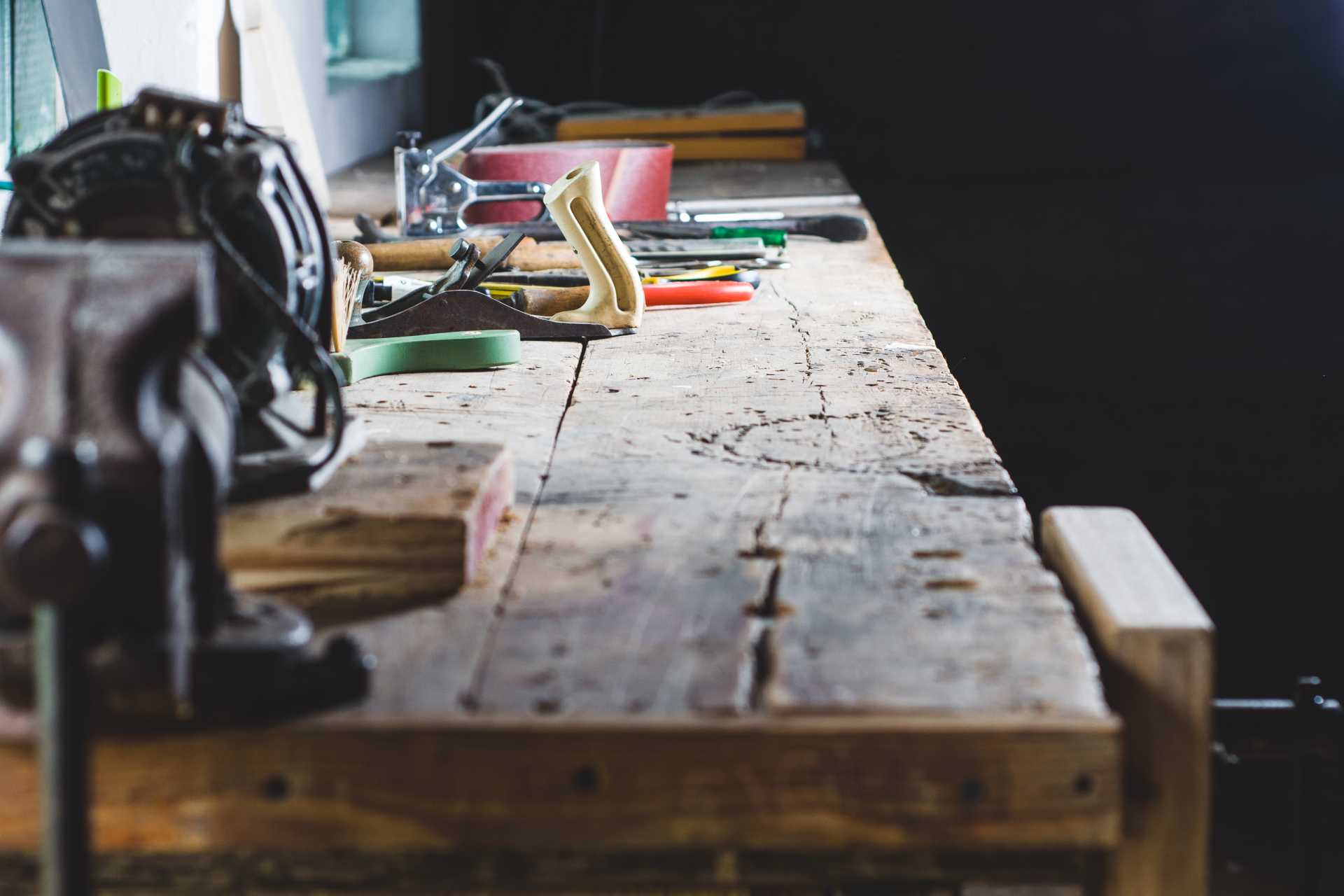 tools on the workbench of the old workshop