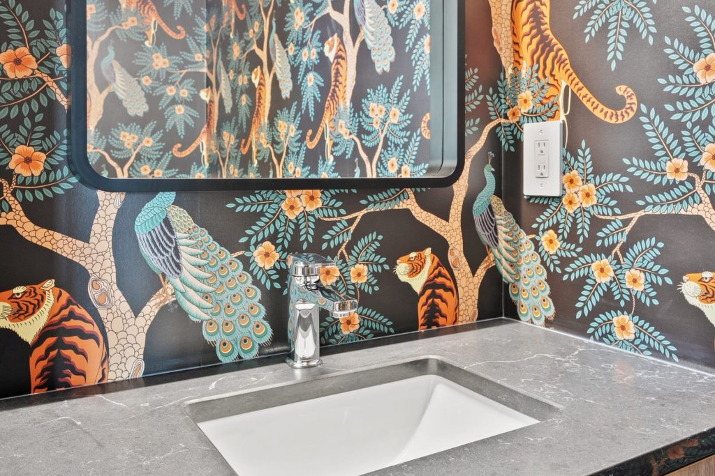Bathroom sink with colorful accent wallpaper