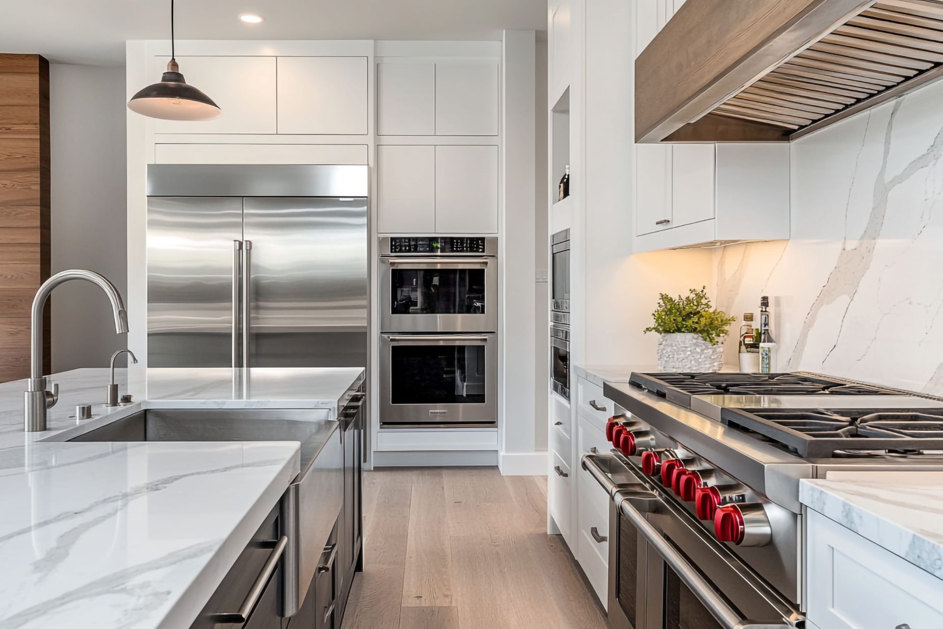A modern, built-in black electric oven installed in a sleek white kitchen cabinet.
