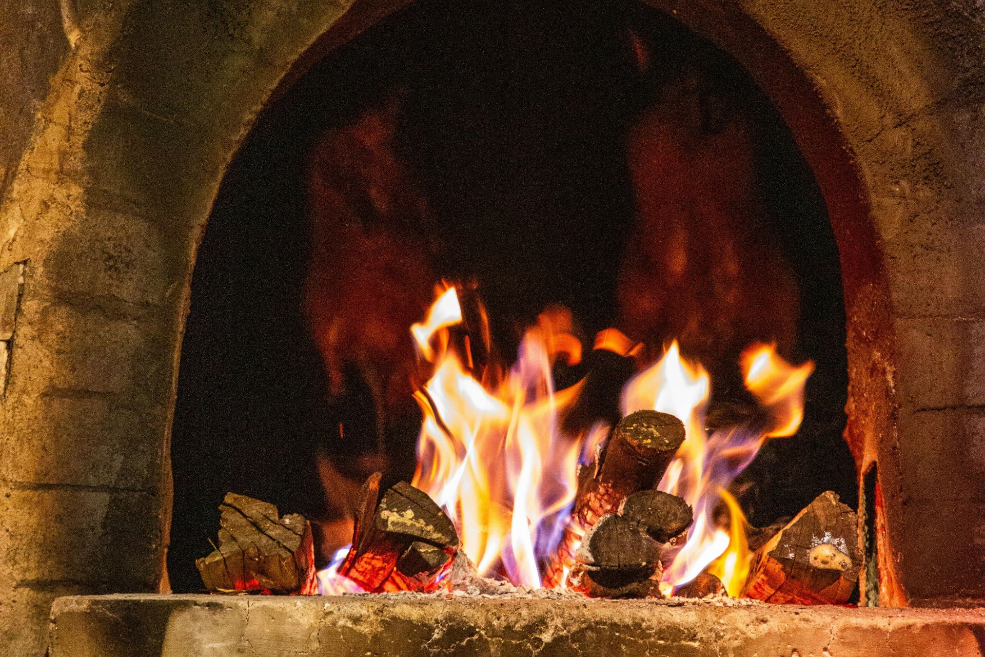 Burning firewood inside a fireplace