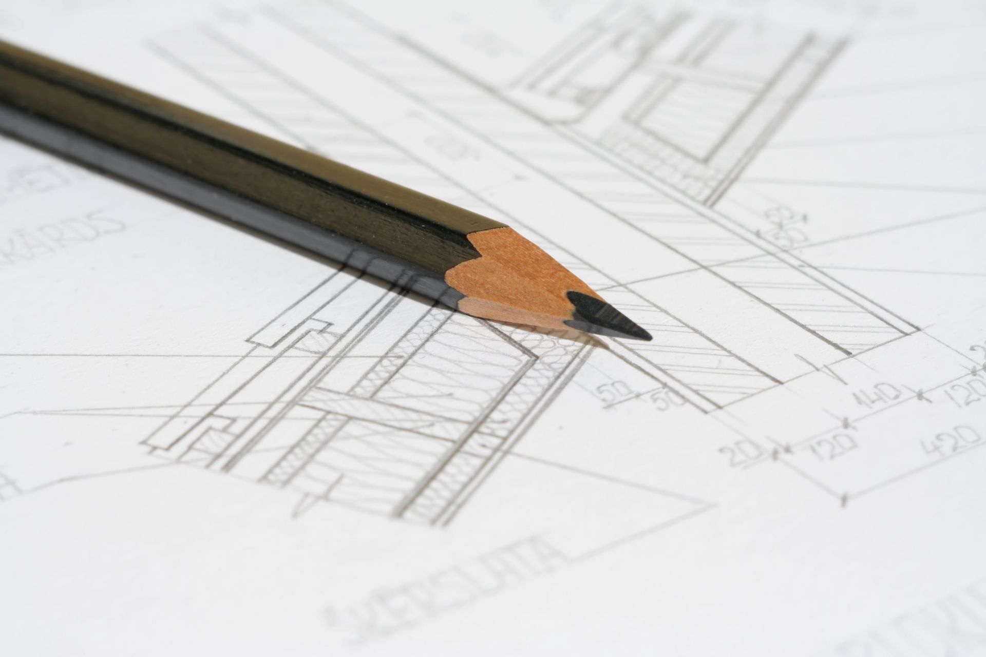 Pencil resting on an architectural building plan